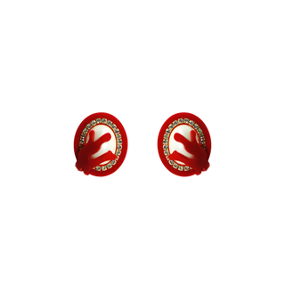 Pair of red earrings with white centers and small stones on a white background