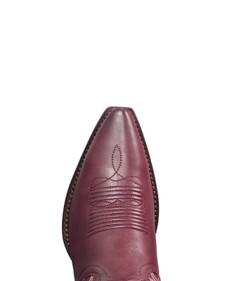 A close-up top-down view of a pointed toe on a burgundy leather boot, showing decorative stitching and contrast stitching along the edge, set against a plain white background.
