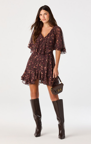 Embrace effortless elegance in this floral chiffon mini dress, designed to make a statement with every step. Featuring a rich, moody floral print on lightweight chiffon, this romantic dress offers a flattering silhouette that's perfect for both daytime events and evening occasions.

The soft V-neckline and dramatic cape sleeves create an elegant, flowing look, while the fitted natural waist enhances your shape before falling into a relaxed, above-the-knee skirt. An asymmetrical flounce hem adds graceful mov