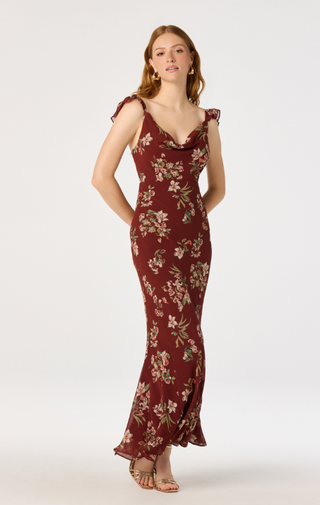 Turn heads in this effortlessly romantic floral satin midi dress, designed to bring timeless elegance to every occasion. Featuring a beautiful allover floral print, this feminine dress is crafted from silky satin fabric with a flattering bias-cut silhouette that drapes beautifully and enhances your natural shape.

The sweetheart-inspired scoop neckline is accented with soft ruffle trim, while delicate ruffle cap sleeves add a graceful, vintage-inspired touch. The midi length creates a sophisticated look tha