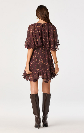 Embrace effortless elegance in this floral chiffon mini dress, designed to make a statement with every step. Featuring a rich, moody floral print on lightweight chiffon, this romantic dress offers a flattering silhouette that's perfect for both daytime events and evening occasions.

The soft V-neckline and dramatic cape sleeves create an elegant, flowing look, while the fitted natural waist enhances your shape before falling into a relaxed, above-the-knee skirt. An asymmetrical flounce hem adds graceful mov